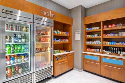 a grocery store with a refrigerator and a lot of drinks at SpringHill Suites by Marriott Cincinnati Midtown in Cincinnati
