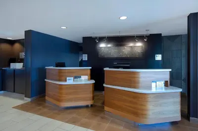 a store with wooden counters and blue walls at Courtyard by Marriott Cincinnati Airport in Erlanger