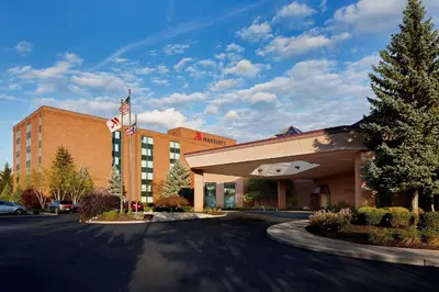 a building with an american flag in front of it at Marriott Cincinnati Northeast in Mason
