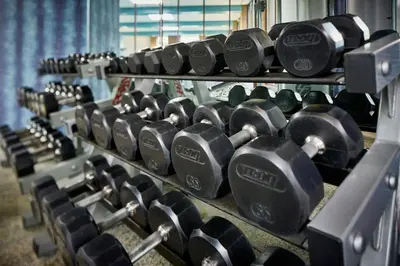 a row of dumbbells lined up in a gym at Marriott Cincinnati Northeast in Mason