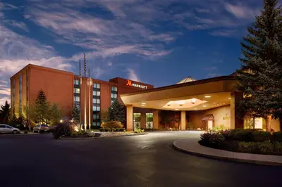 a building with a parking lot in front of it at Marriott Cincinnati Northeast in Mason