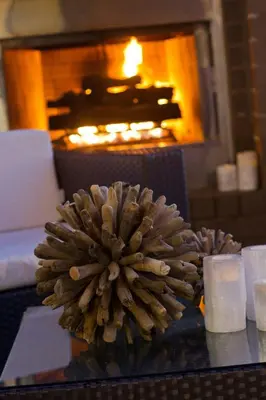 a flower on a table in front of a fireplace at SpringHill Suites Cincinnati Airport South in Florence