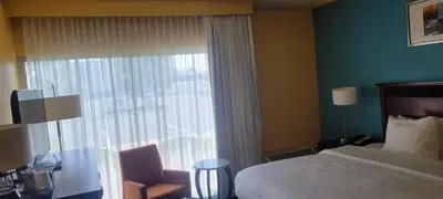 a hotel room with a bed and a window at Chester Inn & Suites in Sharonville