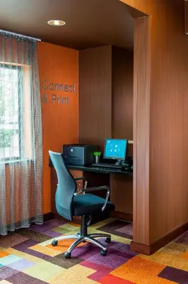 an office with a desk with a computer and a chair at Fairfield Inn & Suites Springfield in Springfield