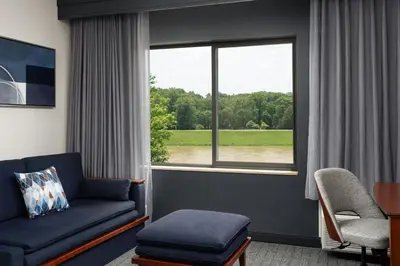 a living room with a couch and a window at Courtyard Dayton-University of Dayton in Dayton