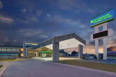 a gas station with a sign in front of it at Wyndham Garden Fort Wayne in Fort Wayne