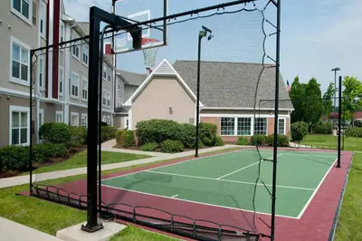 a tennis court in front of a house at Residence Inn by Marriott Fort Wayne Southwest in Fort Wayne