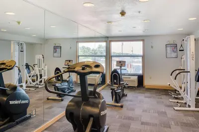 a gym with treadmills and ellipticals in a room at Motel 6-Richmond, IN in Richmond