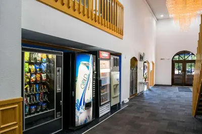a grocery store aisle with vending machines and drinks at Motel 6-Richmond, IN in Richmond