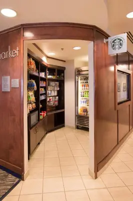 an empty aisle of a grocery store with a refrigerator at Courtyard by Marriott Canton in North Canton