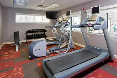 a gym with tread machines and a treadmill at Residence Inn Canton in North Canton