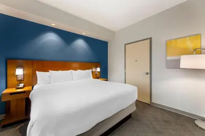 a large white bed in a hotel room at Comfort Inn & Suites Akron South in Akron