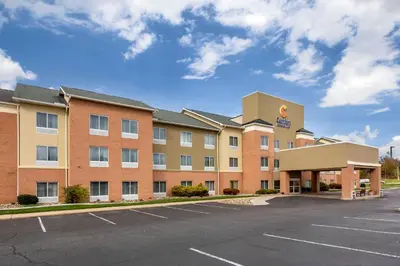 an image of a hotel with a parking lot at Comfort Inn & Suites Akron South in Akron