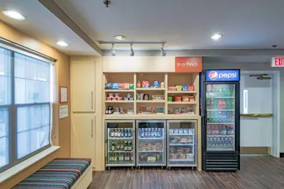 a store with a drink cooler in a store at TownePlace Suites Cleveland Streetsboro in Streetsboro