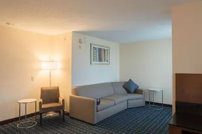 a living room with a couch and a chair at Fairfield Inn & Suites by Marriott Cleveland Streetsboro in Streetsboro
