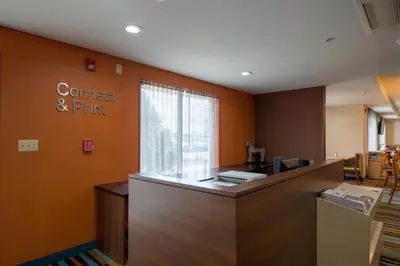 an office with a counter and a sign on the wall at Fairfield Inn & Suites by Marriott Cleveland Streetsboro in Streetsboro