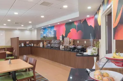 a fast food restaurant with a counter and tables at Fairfield Inn & Suites by Marriott Cleveland Streetsboro in Streetsboro