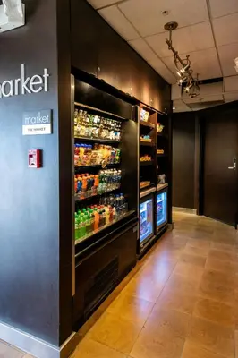 a grocery store with a refrigerator with food and drinks at Courtyard by Marriott Cleveland Willoughby in Willoughby