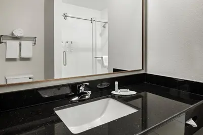 a bathroom with a sink and a large mirror at Fairfield Inn & Suites by Marriott Columbus East in Reynoldsburg