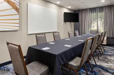 a conference room with a long table and chairs at Fairfield Inn & Suites by Marriott Columbus East in Reynoldsburg