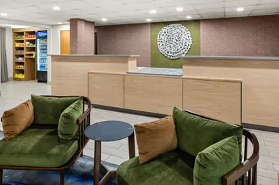 a waiting room with two chairs and a table at Fairfield Inn & Suites by Marriott Columbus East in Reynoldsburg