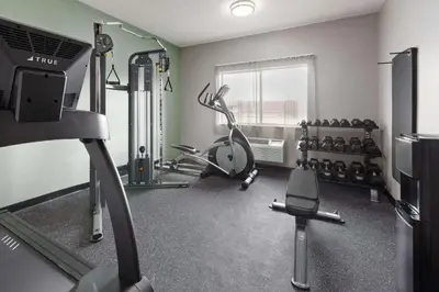 a fitness room with a gym with weights at Wingate by Wyndham Marion in Marion