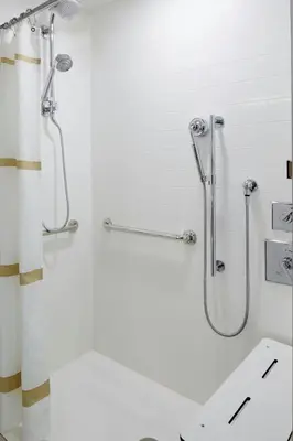 a bathroom with a shower and a toilet and a sink at Marriott Columbus Northwest in Dublin