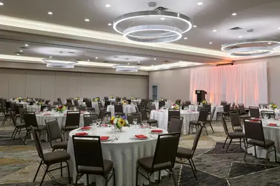 a banquet hall with white tables and chairs at Marriott Columbus Northwest in Dublin