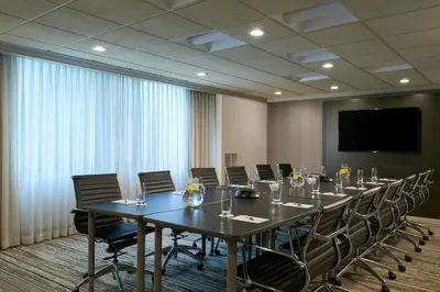 a conference room with a long table and chairs at Marriott Cincinnati North in West Chester
