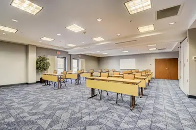 a classroom with tables and chairs in a room at Courtyard Cincinnati North at Union Centre in West Chester