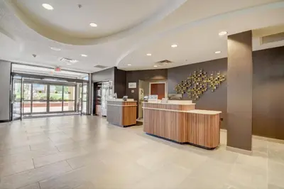 a lobby of a hotel with a reception desk at Courtyard Cincinnati North at Union Centre in West Chester