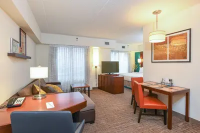 a living room with a room with a couch and a desk at Residence Inn Cincinnati North West Chester in West Chester