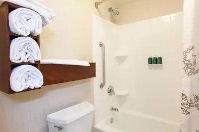 a bathroom with a toilet and a shower and towels at Residence Inn Cincinnati North West Chester in West Chester