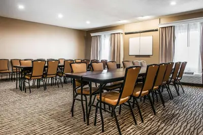 a conference room with a table and chairs at Comfort Inn & Suites Mount Sterling in Mount Sterling