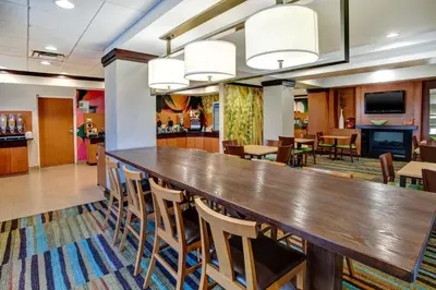 a large dining room with a large table and chairs at Fairfield Inn & Suites by Marriott Lexington North in Lexington