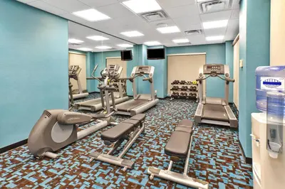 a gym with treadmills and elliptical machines at Fairfield Inn & Suites by Marriott Lexington North in Lexington