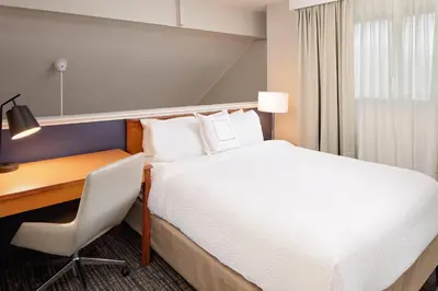 a hotel room with a bed and a desk at Residence Inn by Marriott Lexington North in Lexington