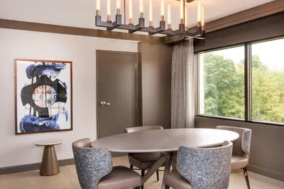 a dining room with a table and chairs at Pittsburgh Airport Marriott in Robinson Township