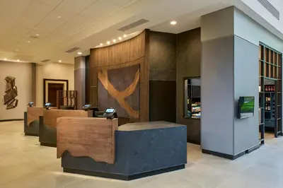 a lobby with a reception desk in a building at Pittsburgh Airport Marriott in Robinson Township