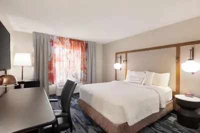 a hotel room with a bed and a desk at Fairfield Inn & Suites Wheeling - St. Clairsville, OH in Saint Clairsville