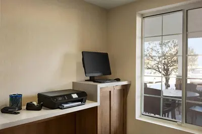 a room with a tv and a printer and a window at Fairfield Inn & Suites Wheeling - St. Clairsville, OH in Saint Clairsville