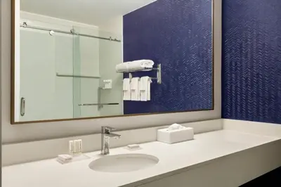 a bathroom with a sink and a mirror at Fairfield Inn & Suites Wheeling - St. Clairsville, OH in Saint Clairsville