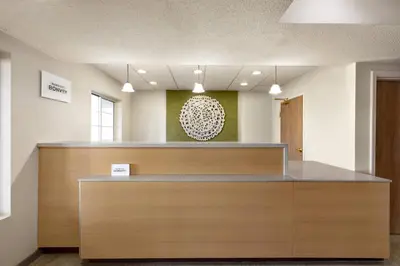 a lobby with a reception desk in a building at Fairfield Inn & Suites Wheeling - St. Clairsville, OH in Saint Clairsville