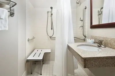 a bathroom with a sink and a shower at SpringHill Suites by Marriott Wheeling Triadelphia Area in Wheeling