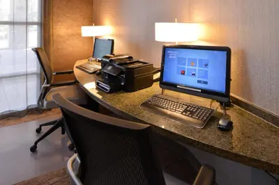a desk in a hotel room with a computer on it at SpringHill Suites by Marriott Wheeling Triadelphia Area in Wheeling
