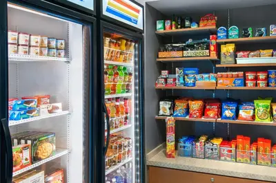a refrigerator filled with lots of different types of food at SpringHill Suites by Marriott Wheeling Triadelphia Area in Wheeling