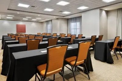 a conference room with black tables and chairs at SpringHill Suites by Marriott Wheeling Triadelphia Area in Wheeling