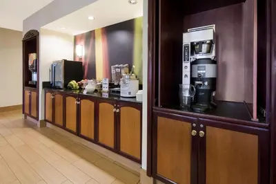 a hotel room with a bar with a coffee maker at SpringHill Suites by Marriott Pittsburgh Washington in Washington