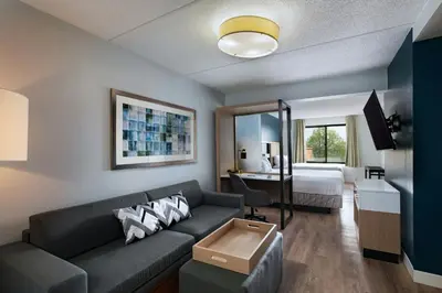 a living room with a couch and a bed at SpringHill Suites by Marriott Pittsburgh Washington in Washington