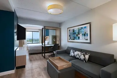 a living room with a couch and a bed at SpringHill Suites by Marriott Pittsburgh Washington in Washington